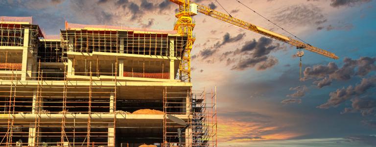 Construction Botswana, Africa, construction site in the city with a yellow crane.