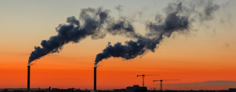 Sunset Paris skyline showing smoke stacks.