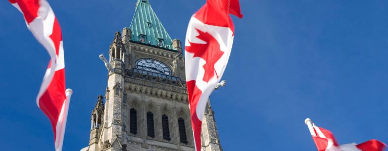 Canadian flags in front of the parliament building