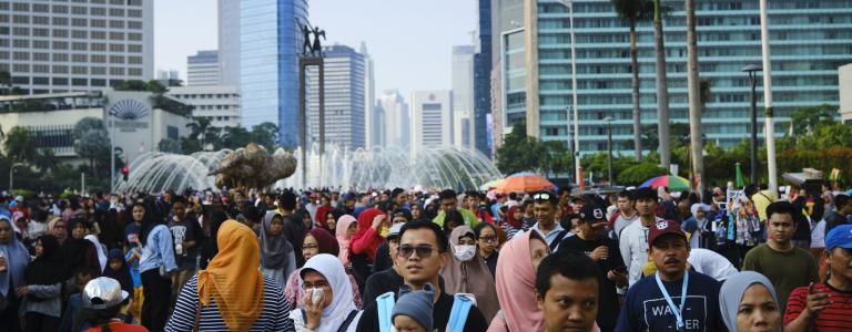 People walk through the streets in Indonesia