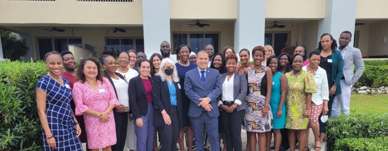 A group photograph from a National Adaptation Plan Global Network Peer Learning Summit in Jamaica in 2022