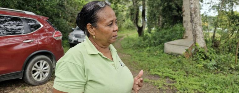 woman standing in a forested area