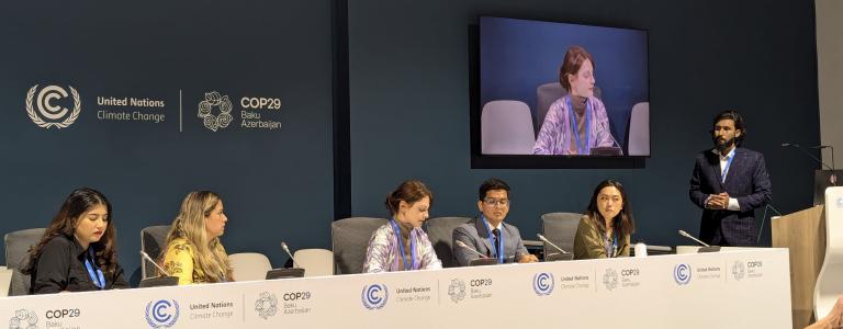 Young people sit on a panel at COP in Azerbaijan