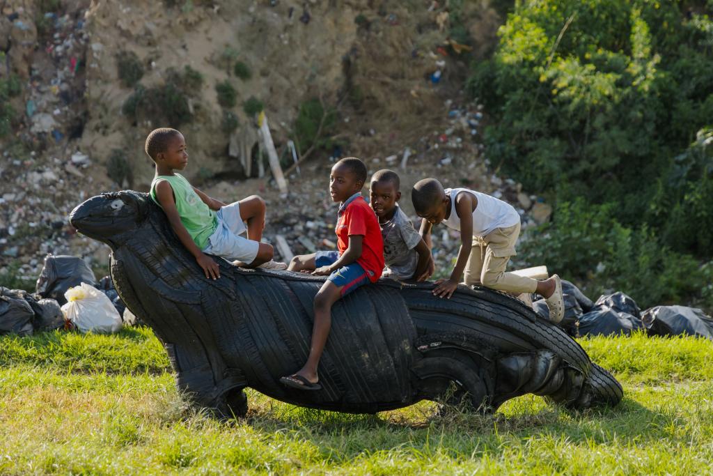 SUNCASA | Kids playing on a mongoose sculpture in Alexandra, Johannesburg.